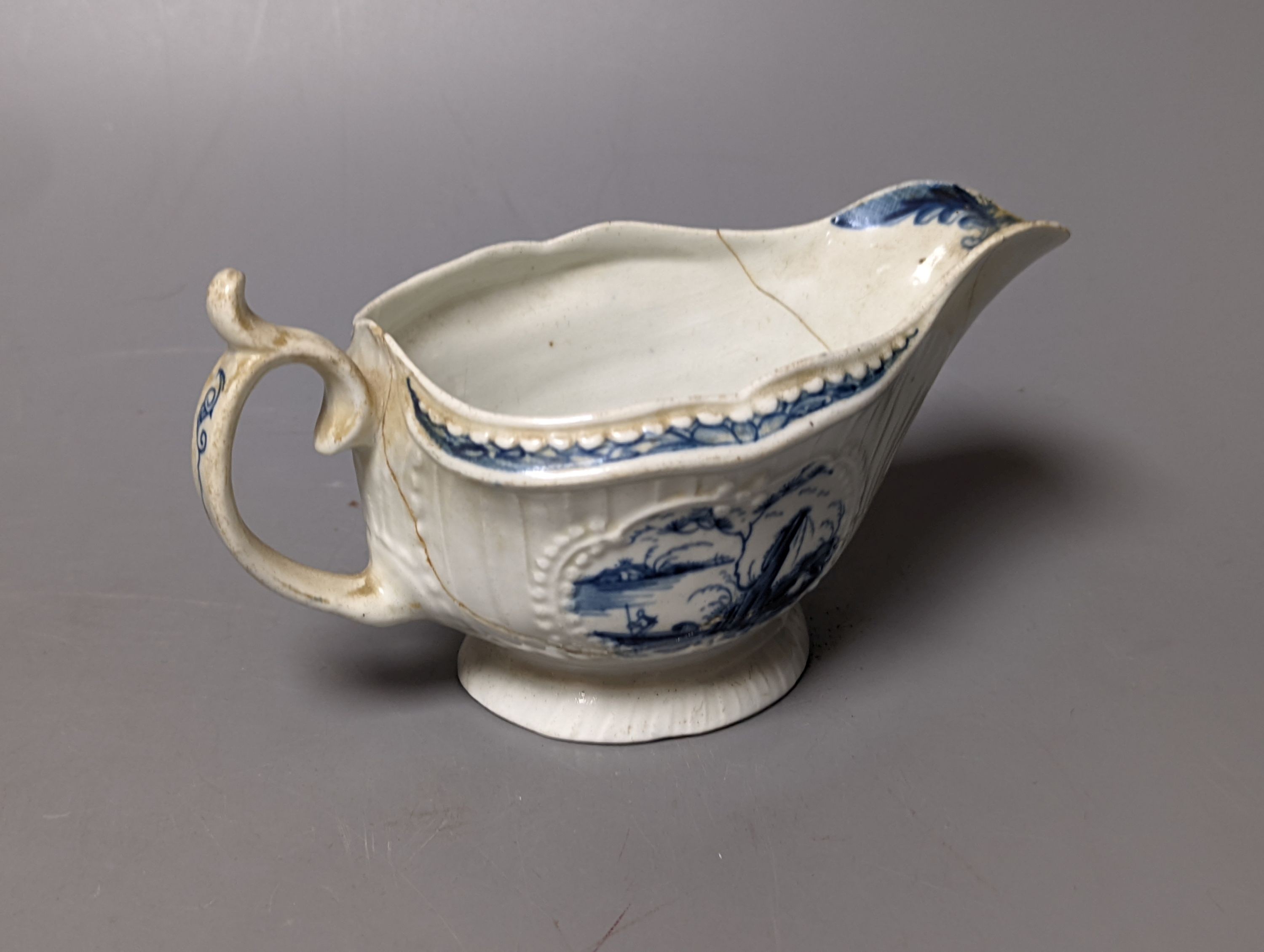 A Worcester blue and white sauceboat, two tea bowls and saucers, late 18th century and a Japanese single saucer. (7)